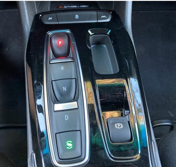 Chevy Bolt Gear Shift A photo of the center console of the 2023 Chevy Bolt, showing the gear shifter